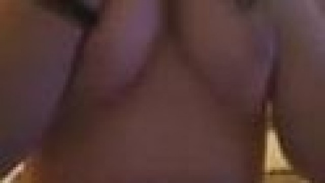 Brunette – Showing off her natural tits